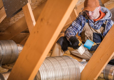 Male Contractor Binding Ventilation Pipes With Duct Tape