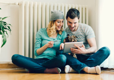 Happy Couple Shopping Online WIth Tablet.